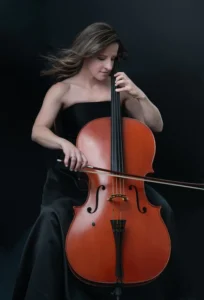 Diana Curtis playing cello in a black dress